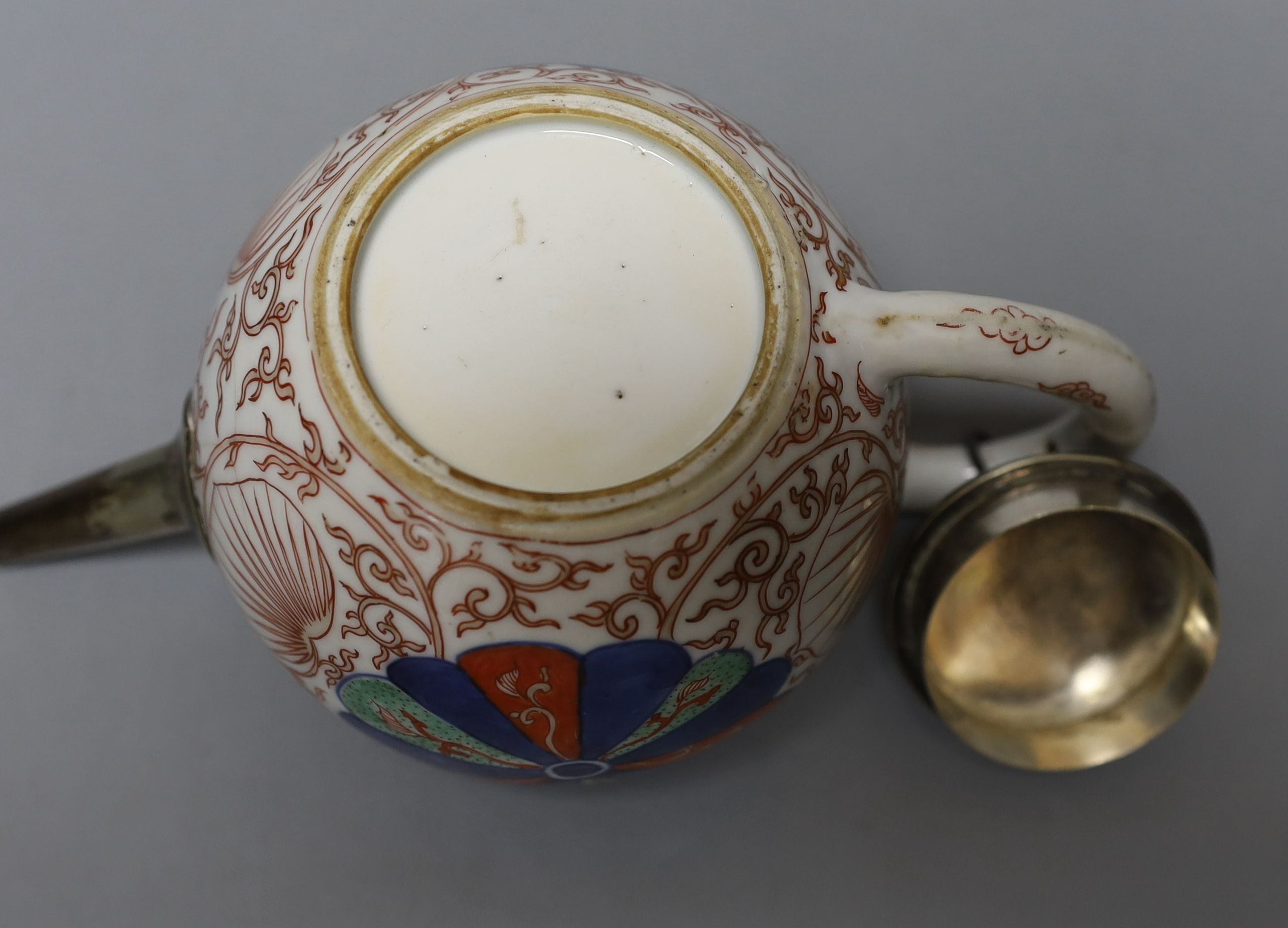 A Chinese Kangxi white metal-mounted porcelain teapot 19cm long